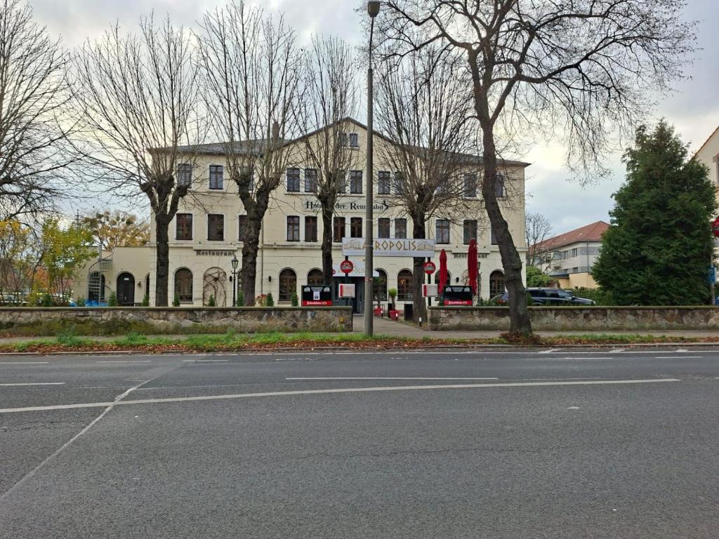 a large white building on the side of a street at Hotel an der Rennbahn in Dresden