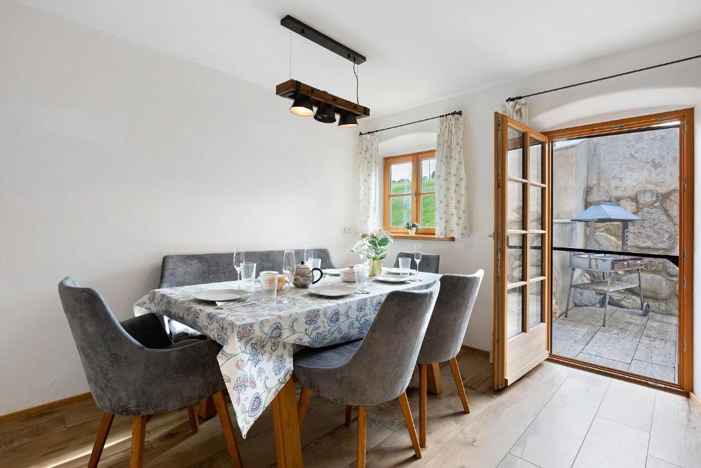 a dining room with a table and chairs at Ferienhaus Region Tegernsee in Eben