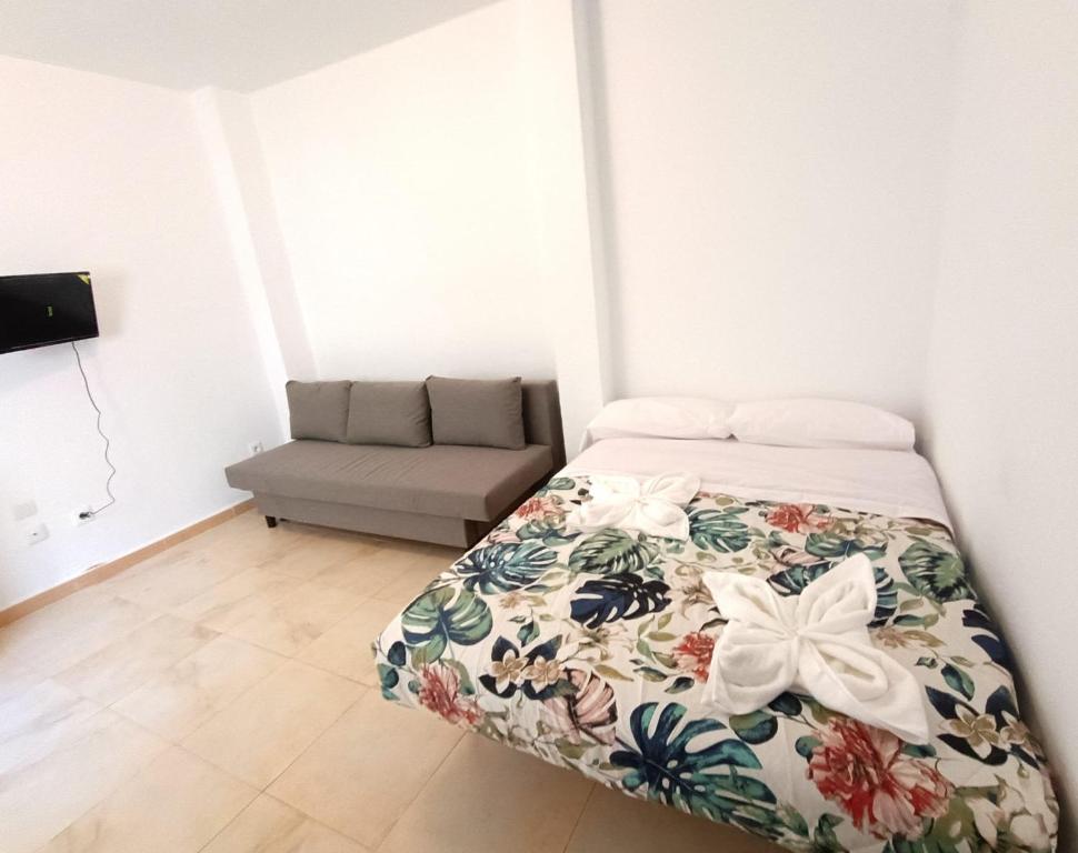 Ένα ή περισσότερα κρεβάτια σε δωμάτιο στο plaza de los mártires