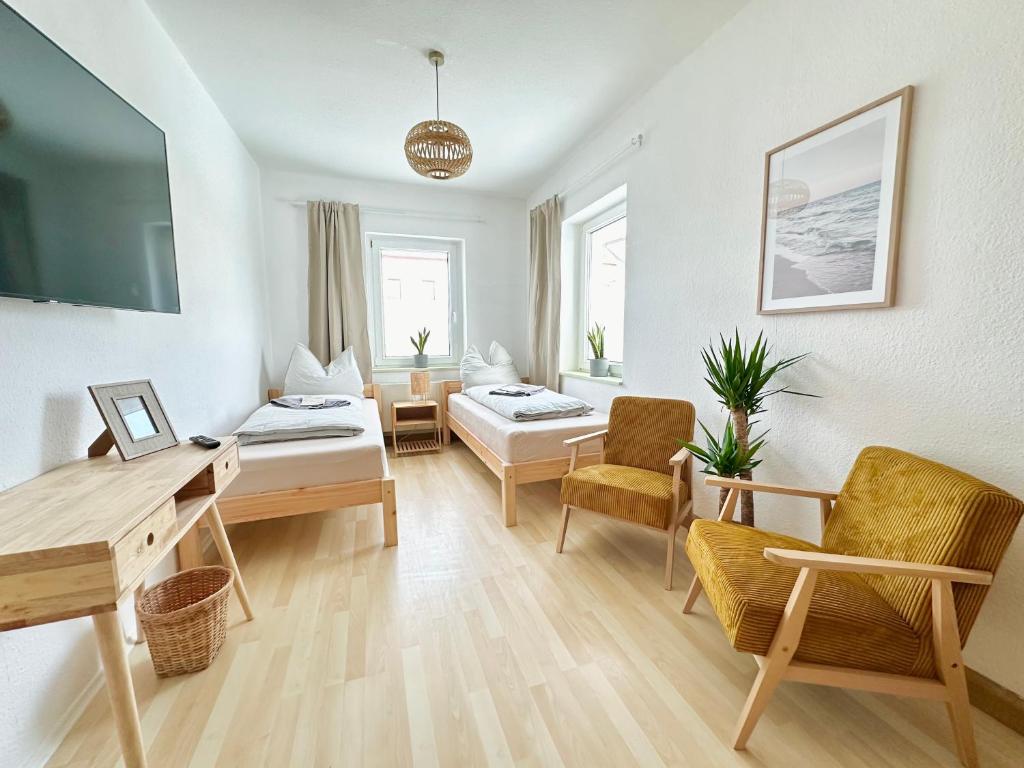 En eller flere senge i et værelse på Gemütliches 3-Raum-Nest im 2.OG