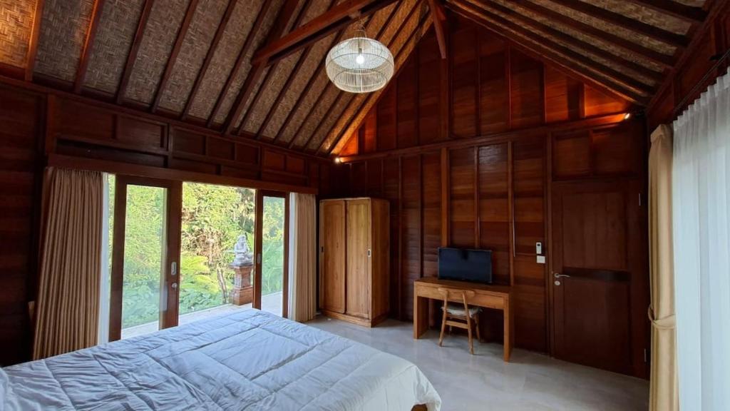 Postel nebo postele na pokoji v ubytování Villa Pondok Utu 5, Ubud - Bali