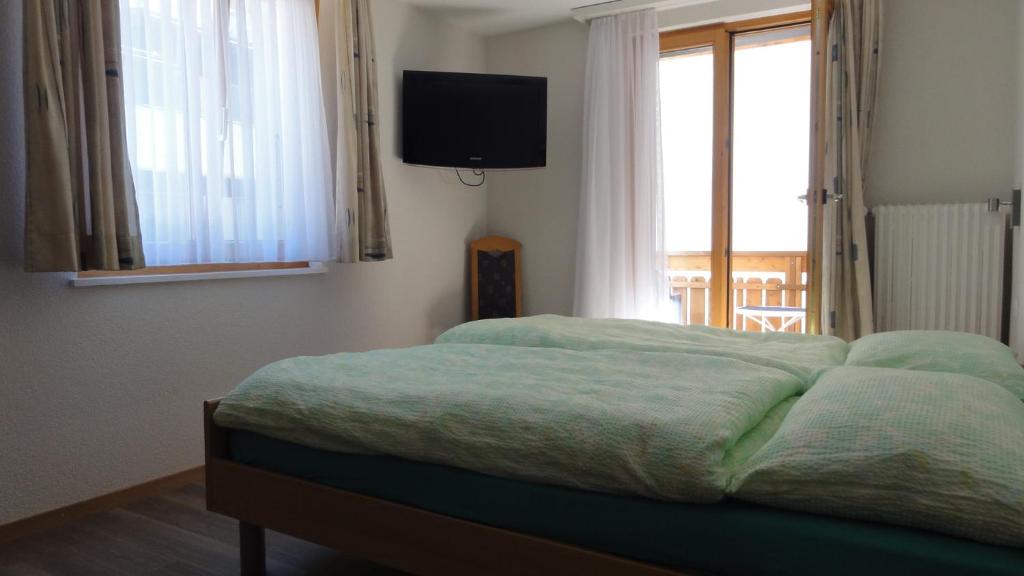 Postel nebo postele na pokoji v ubytování Haus Holiday
