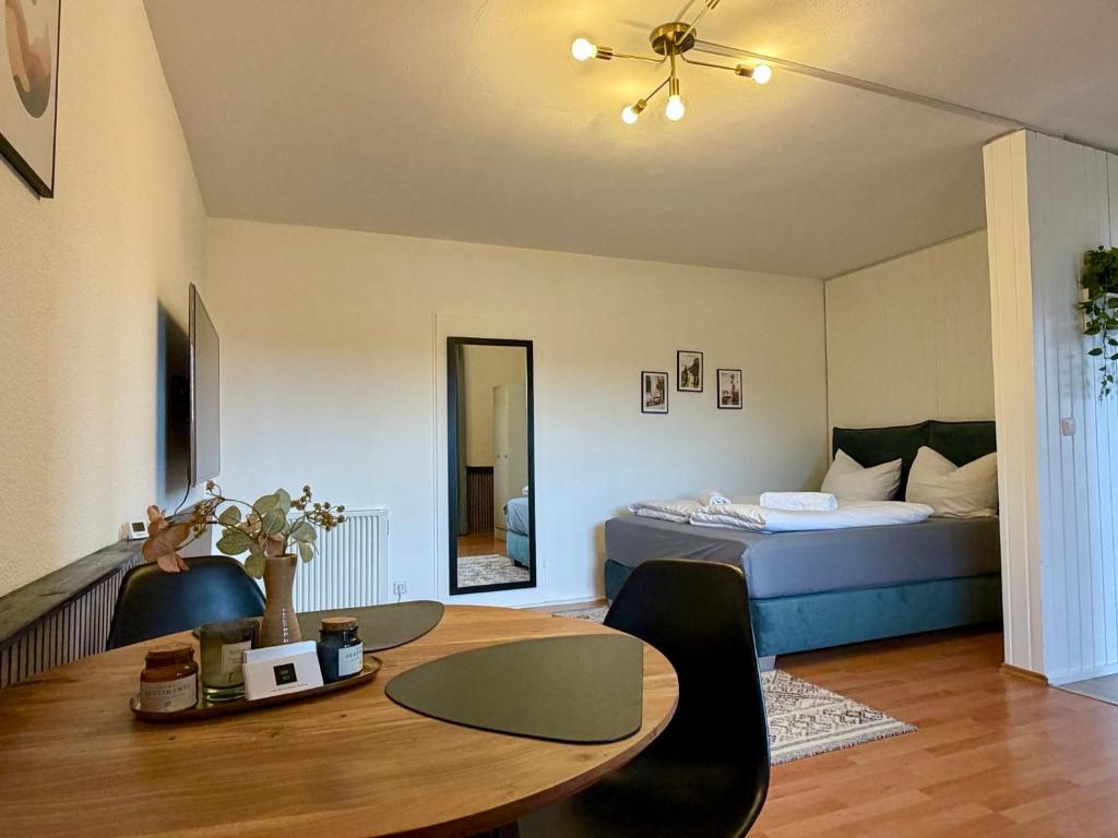 a room with a bed and a table and a bed at Studio No 3 in Fulda