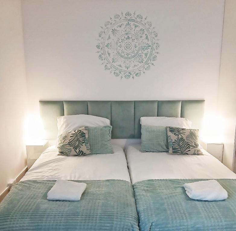 a bed with two pillows on top of it at KRK stop in Cholerzyn