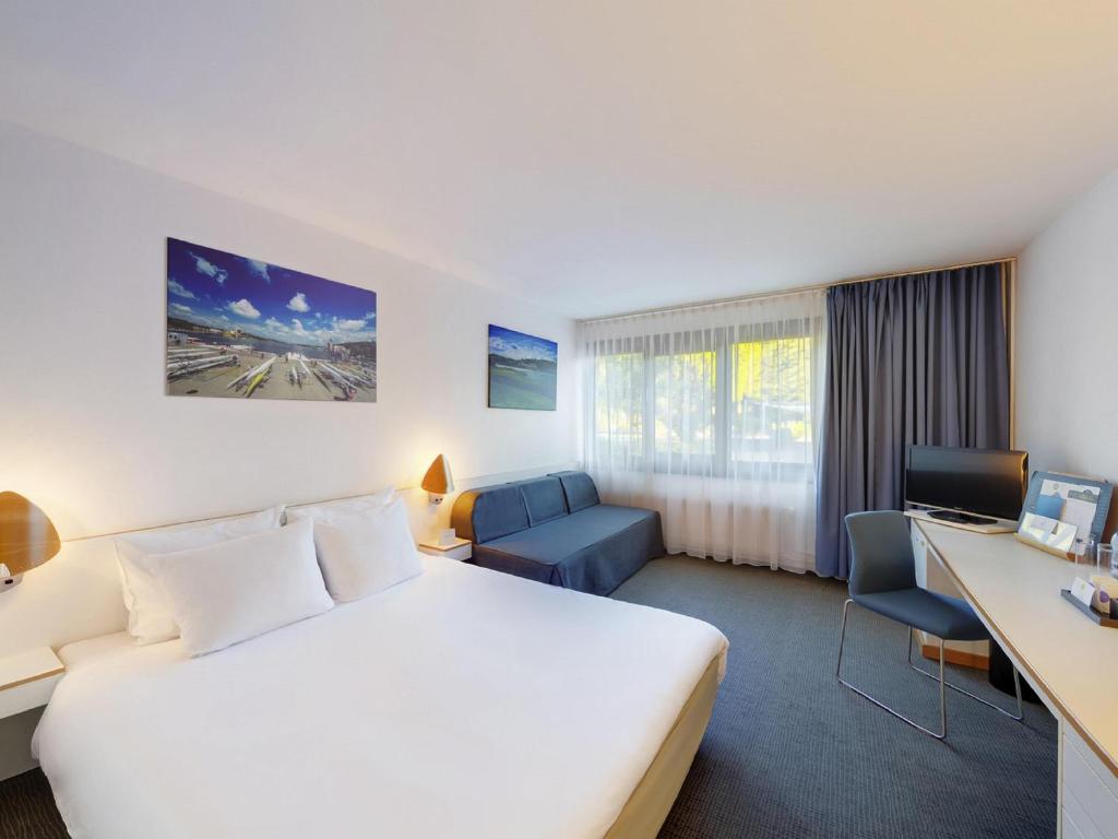 Postel nebo postele na pokoji v ubytování Novotel Poznań Malta