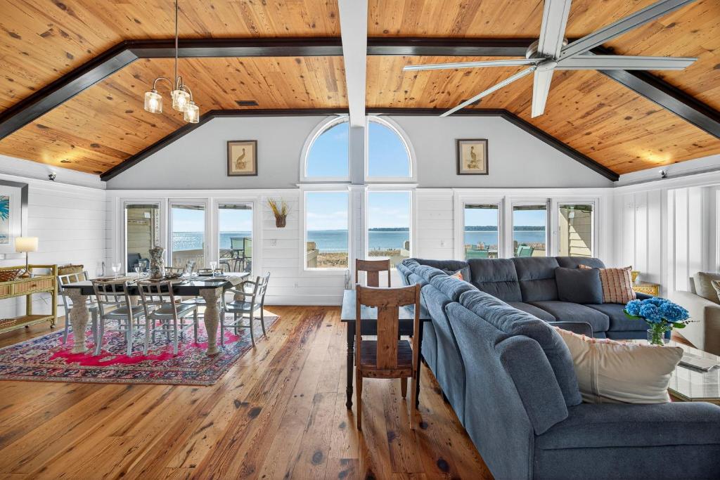 a living room with a couch and a table at PW1310: 1310 Pelican Watch in Seabrook Island