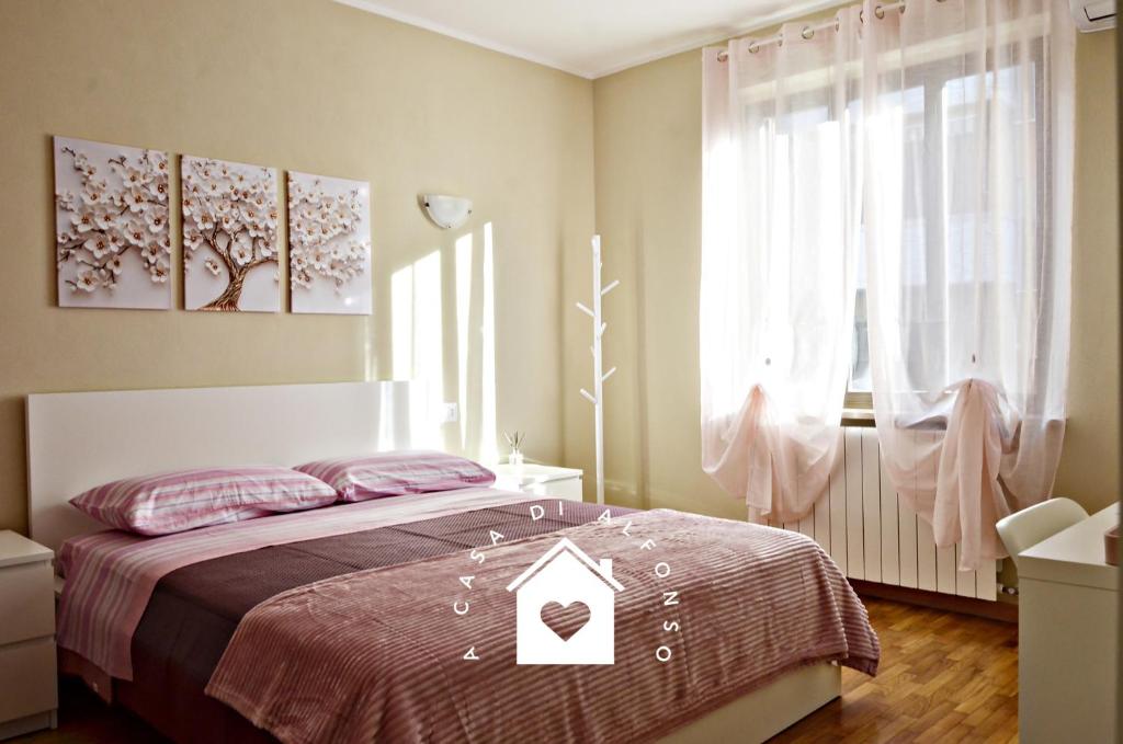 Postel nebo postele na pokoji v ubytování A Casa di Alfonso Malpensa Airport