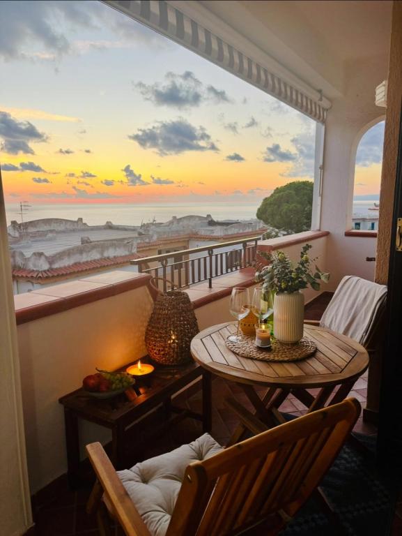a room with a table and a view of the ocean at Brezza Calabra Sea View Apartments in Scalea