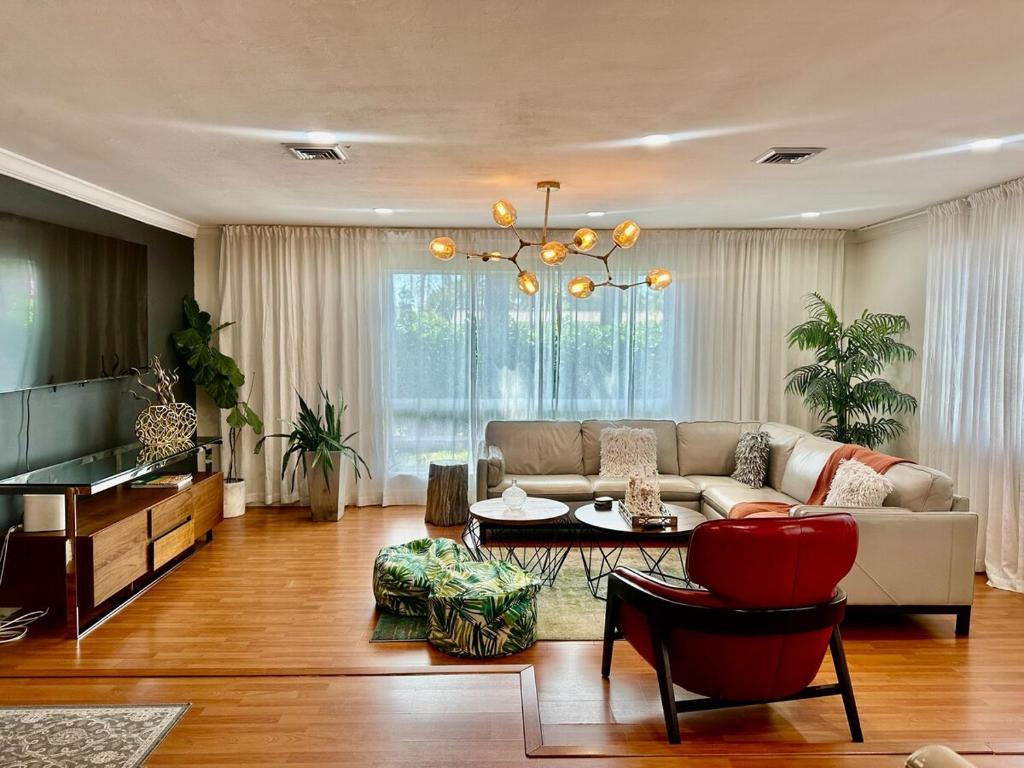 a living room with a couch and a table at The Hollywood Beach Experience in Hollywood