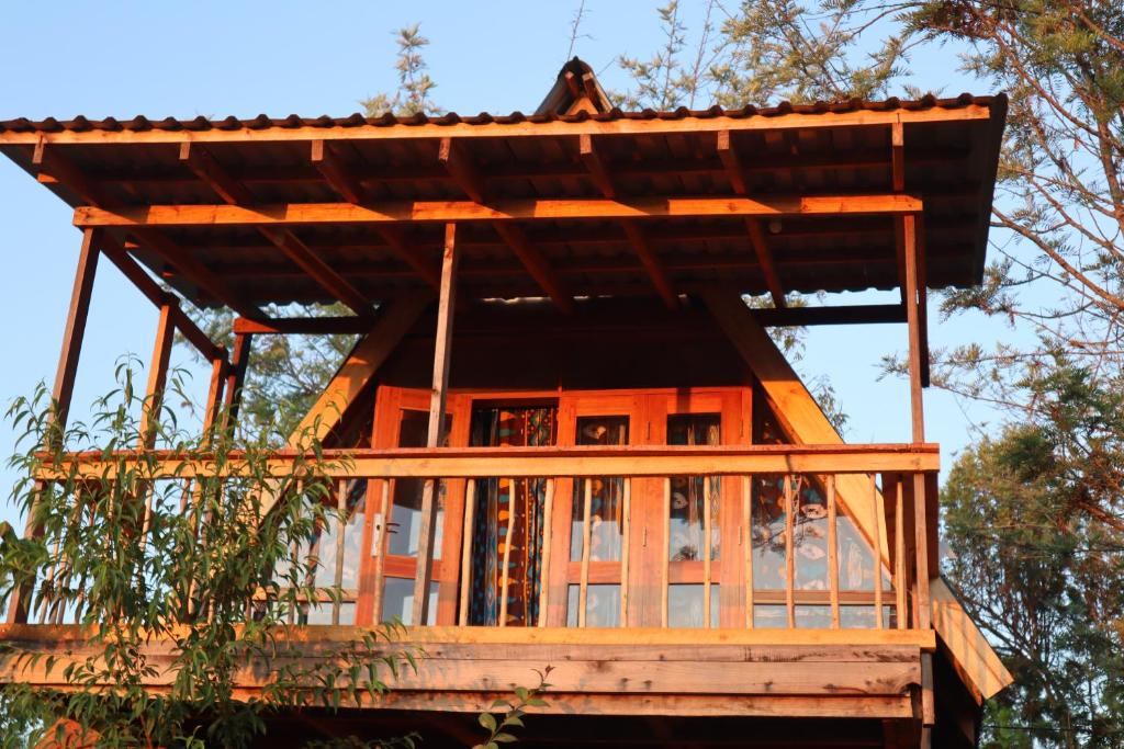 a tree house with a roof at Malasy camping site in Makungulu