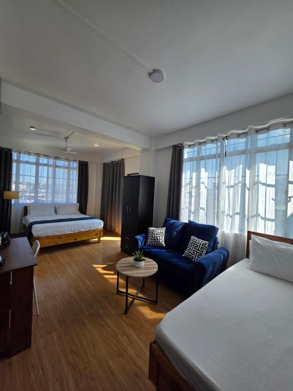 Ένα ή περισσότερα κρεβάτια σε δωμάτιο στο The Olive Inn