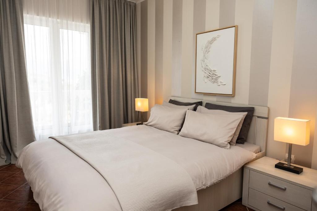 Postel nebo postele na pokoji v ubytování Monte Aria panorama suites