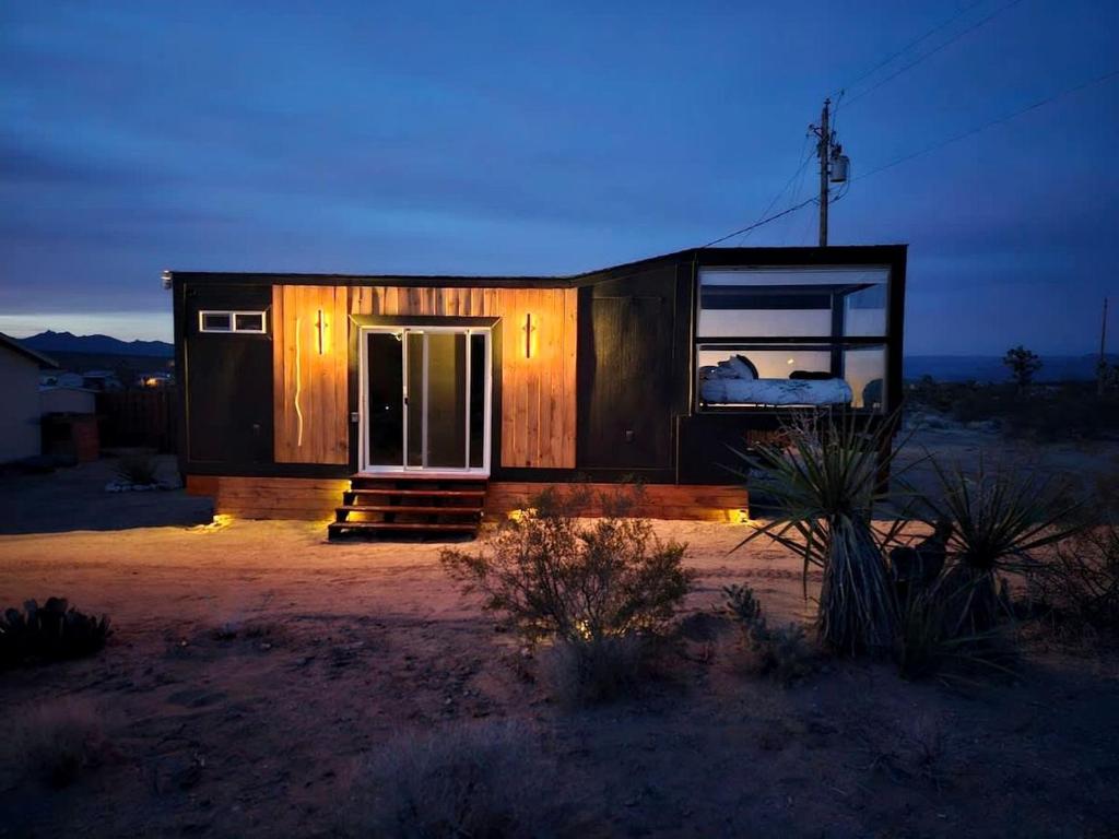 a tiny house in the desert at night at Arizona Adventure Awaits: Glamping Rental Offering Exquisite Views in Meadview