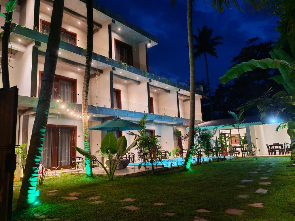 an exterior view of a hotel at night at Amarante Madiha in Matara