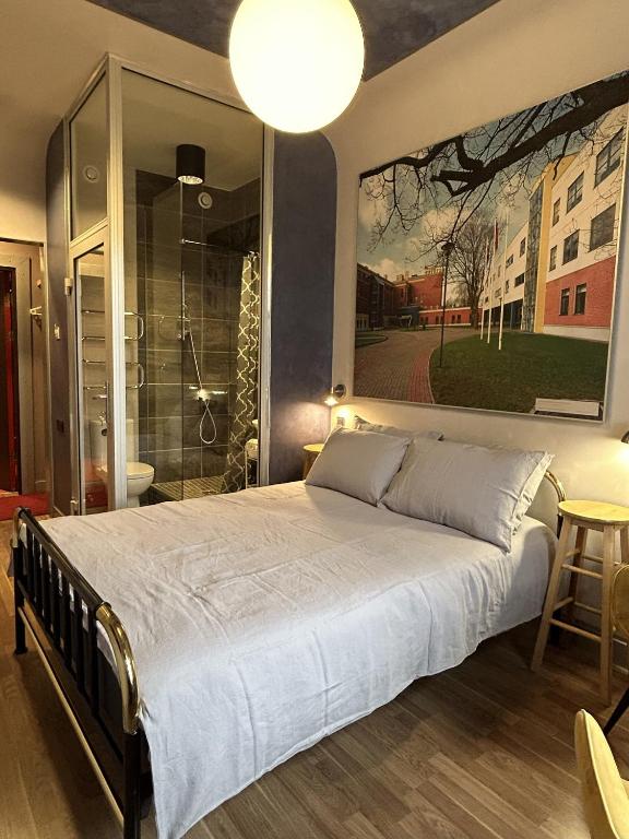 a bedroom with a large bed and a shower at RedDoor Apartment 21 FreeParking in Riga