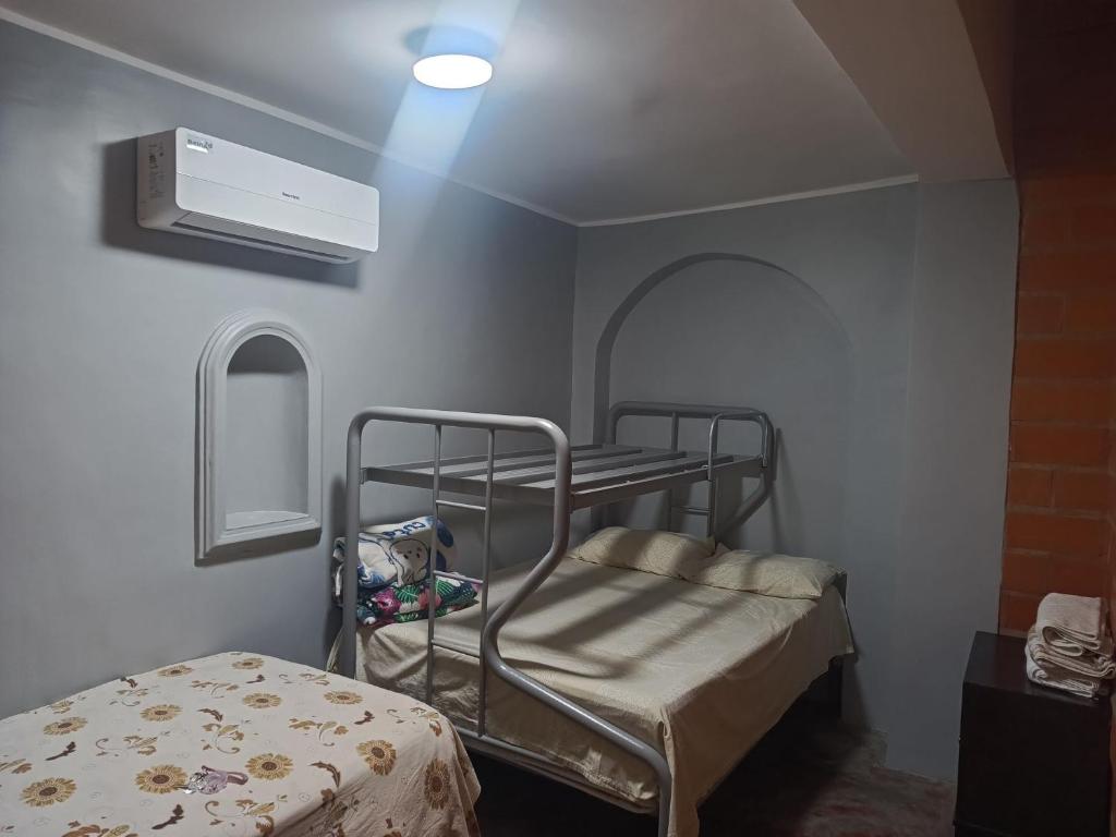 Postel nebo postele na pokoji v ubytování Casa la cubanita