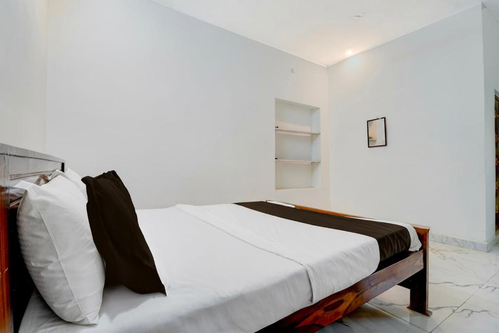 Ένα ή περισσότερα κρεβάτια σε δωμάτιο στο Hotel O ATR Residency