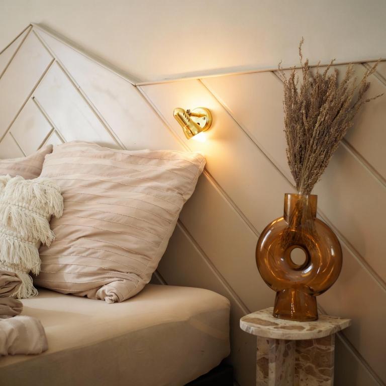 a corner of a room with a pillow and a lamp at Grazerhof in Graz