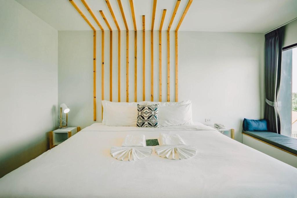 Ένα ή περισσότερα κρεβάτια σε δωμάτιο στο The Galla Hotel