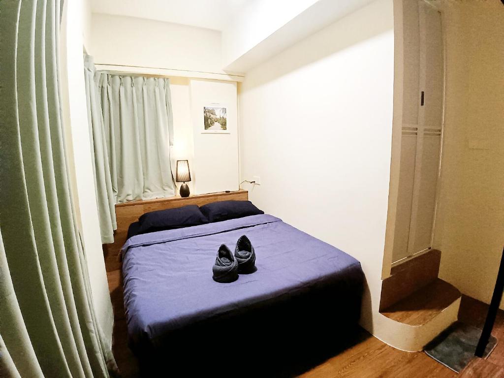 Postel nebo postele na pokoji v ubytování KK Home Warisan Square