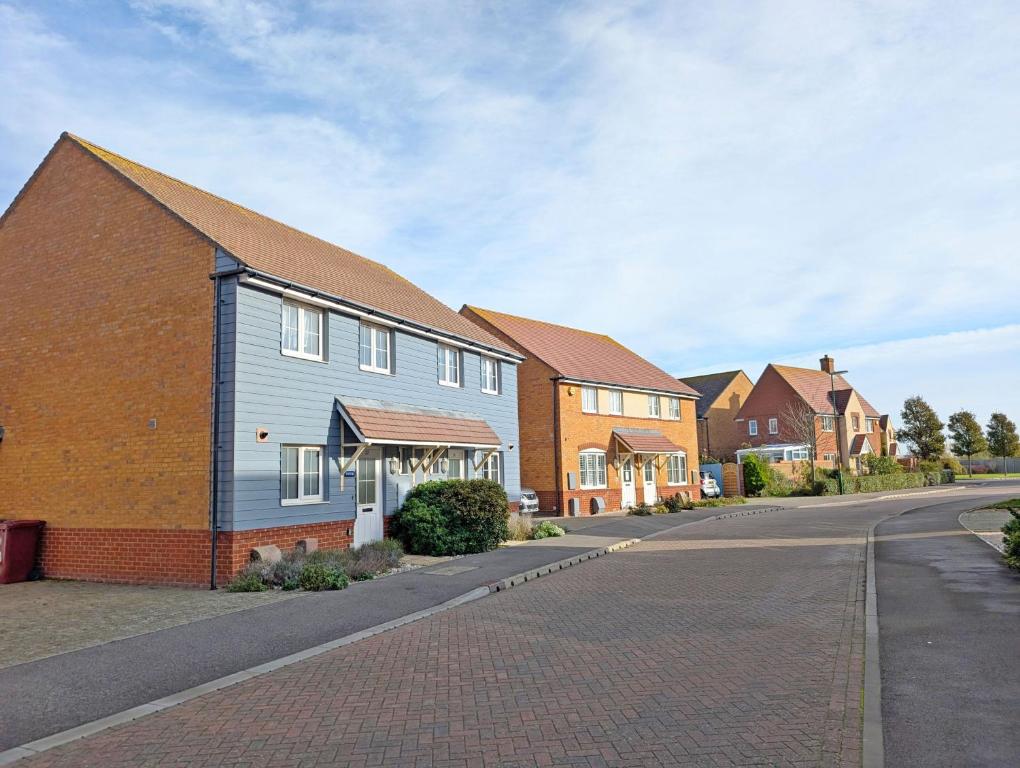 a row of houses on a residential street at Oysters in West Wittering
