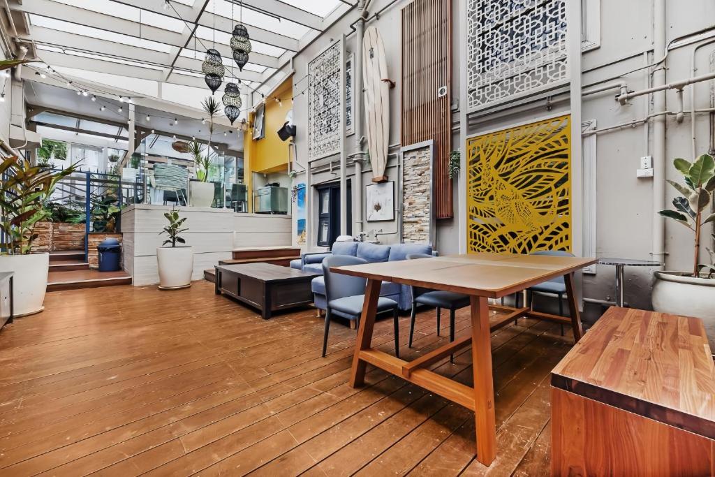a conference room with a table and chairs at London Gate Backpackers Hotel in Sydney