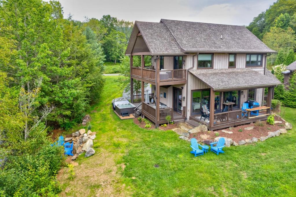 an aerial view of a house with blue chairs at Maynard Rocks IV at Elk Creek in Banner Elk