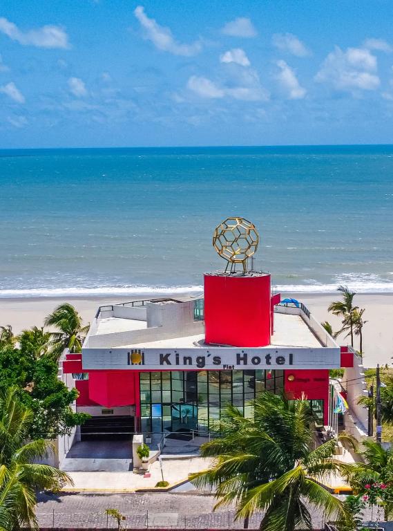 a hotel on the beach with the ocean in the background at KING's FLAT HOTEL NATAL in Natal