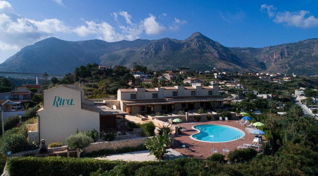 an aerial view of a resort with a swimming pool at Riva Sea Apartments in Castellammare del Golfo