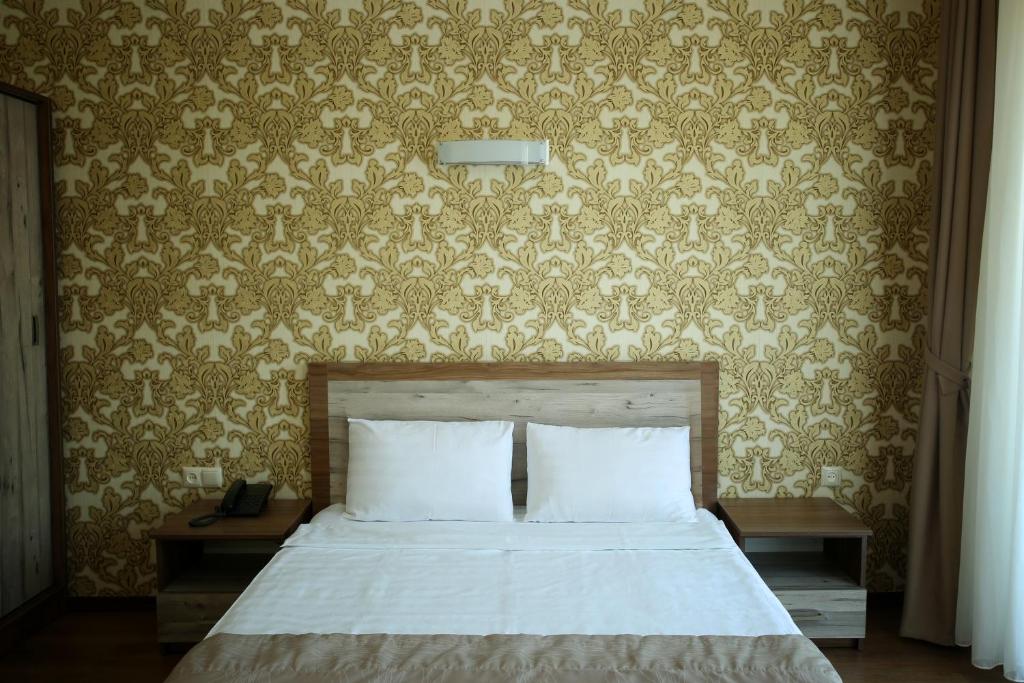 Postel nebo postele na pokoji v ubytování Hotel Gureli