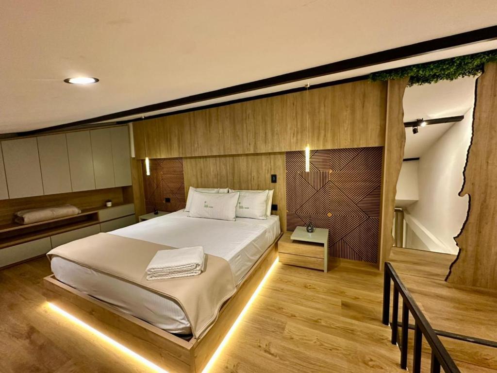 Ένα ή περισσότερα κρεβάτια σε δωμάτιο στο Green House Hotel