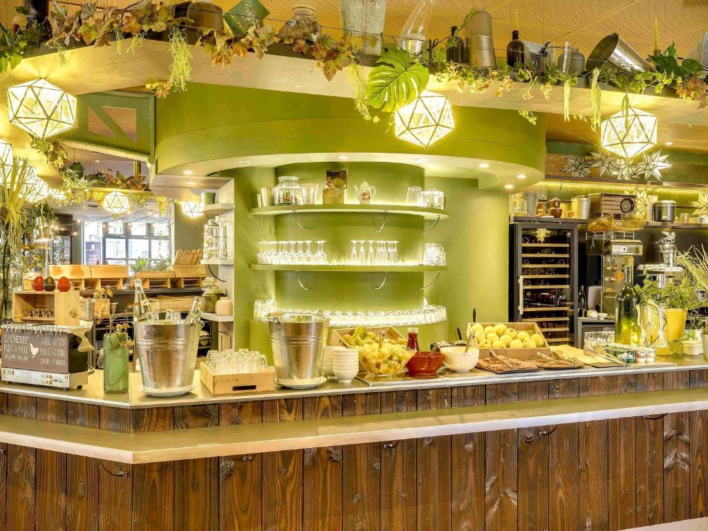 a kitchen with a counter with food on it at ibis Paris Bastille Opera in Paris