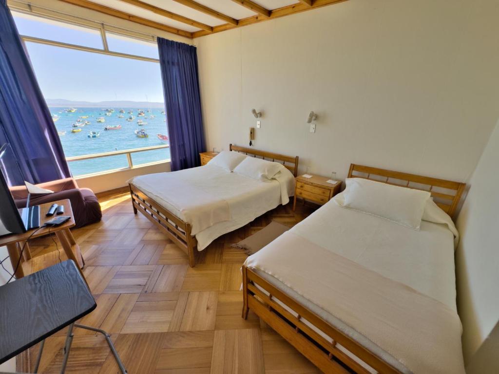 Ένα ή περισσότερα κρεβάτια σε δωμάτιο στο Hotel Panoramico