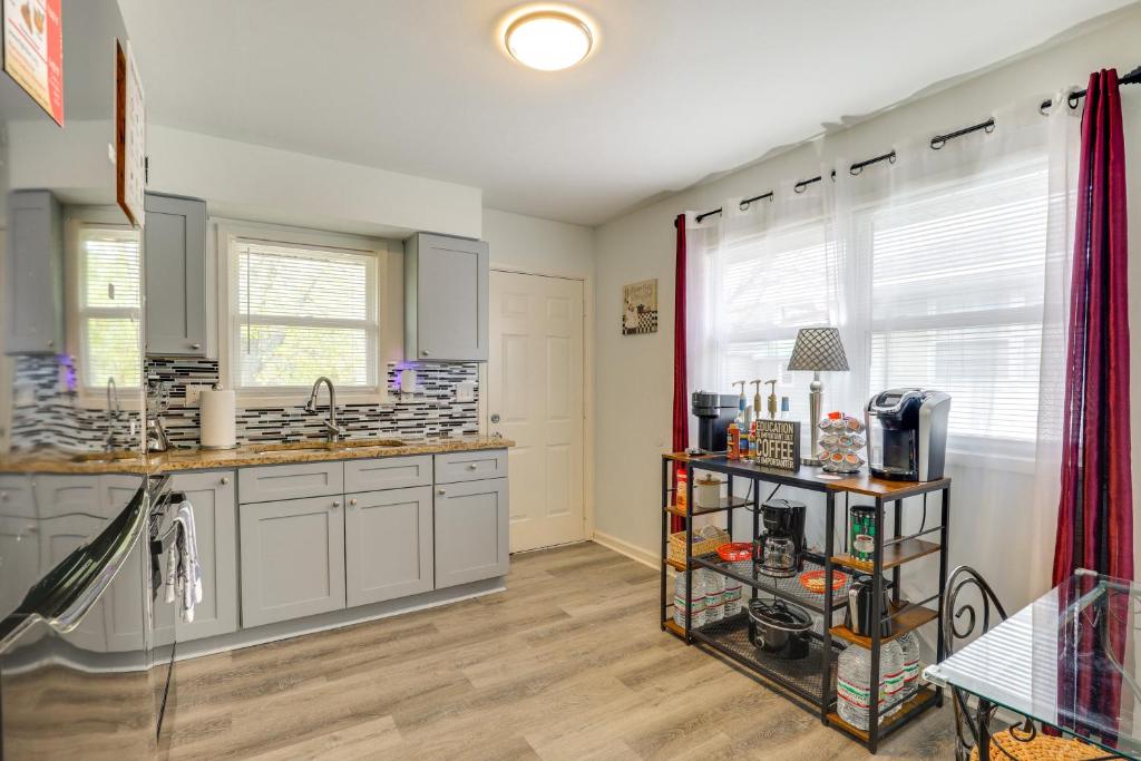 a kitchen with a sink and a counter at 1 Mi to Truman Library Apt with Large Yard! in Sugar Creek