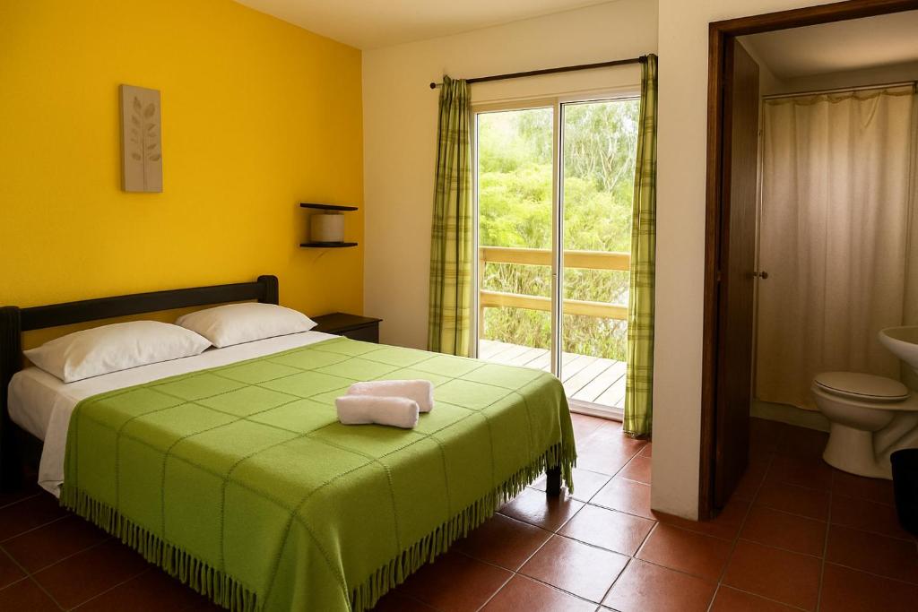 Postel nebo postele na pokoji v ubytování Posada La Pedrera