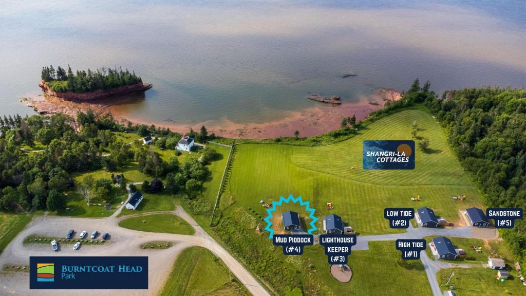 an aerial view of an island in a body of water at Shangri-La Cottages in Burntcoat