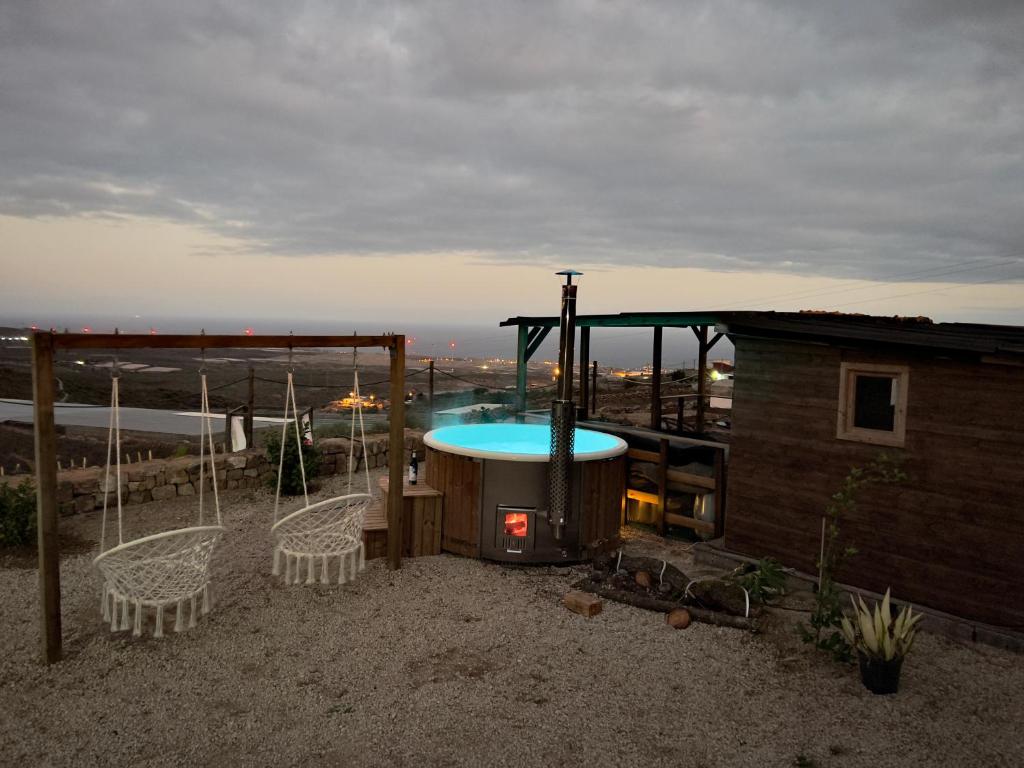 a hot tub sitting on the roof of a house at Finca La Suerte in Chimiche