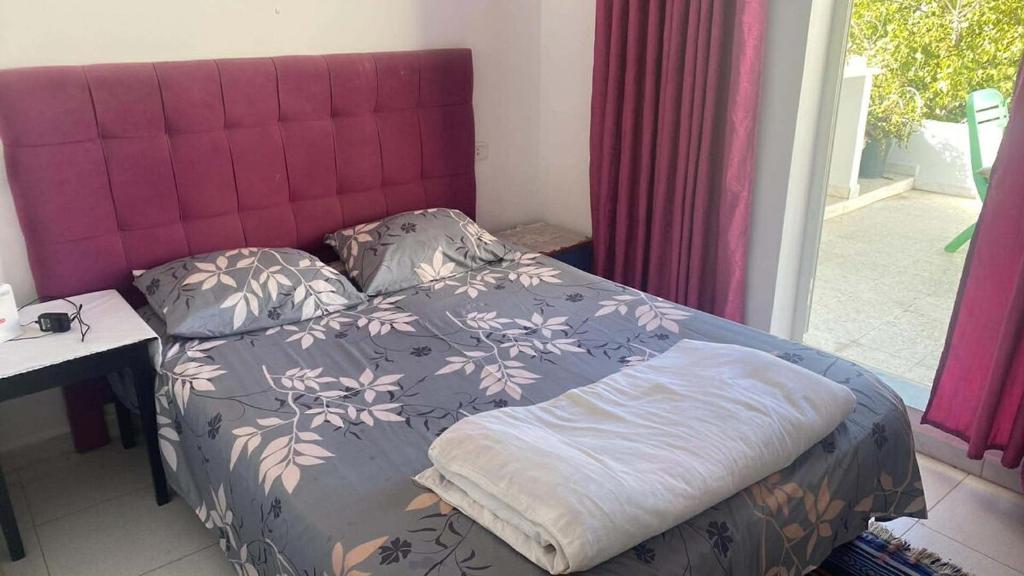 Una cama o camas en una habitación de Lovely apartment in La Marsa