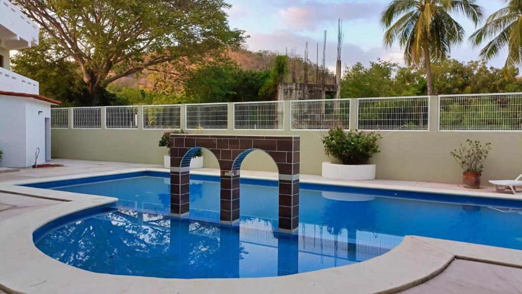 Het zwembad bij of vlak bij Condominio Alegre Amanecer