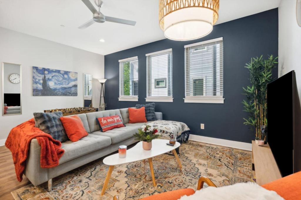 a living room with a couch and a table at The Charm 2BD In the Heart of Magnolia in Fort Worth