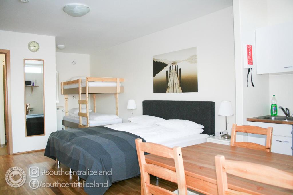 Postel nebo postele na pokoji v ubytování South Central Apartments