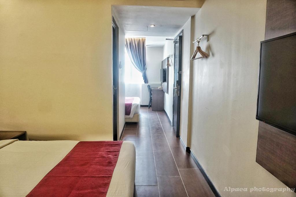 Postel nebo postele na pokoji v ubytování Nex Hotel Johor Bahru