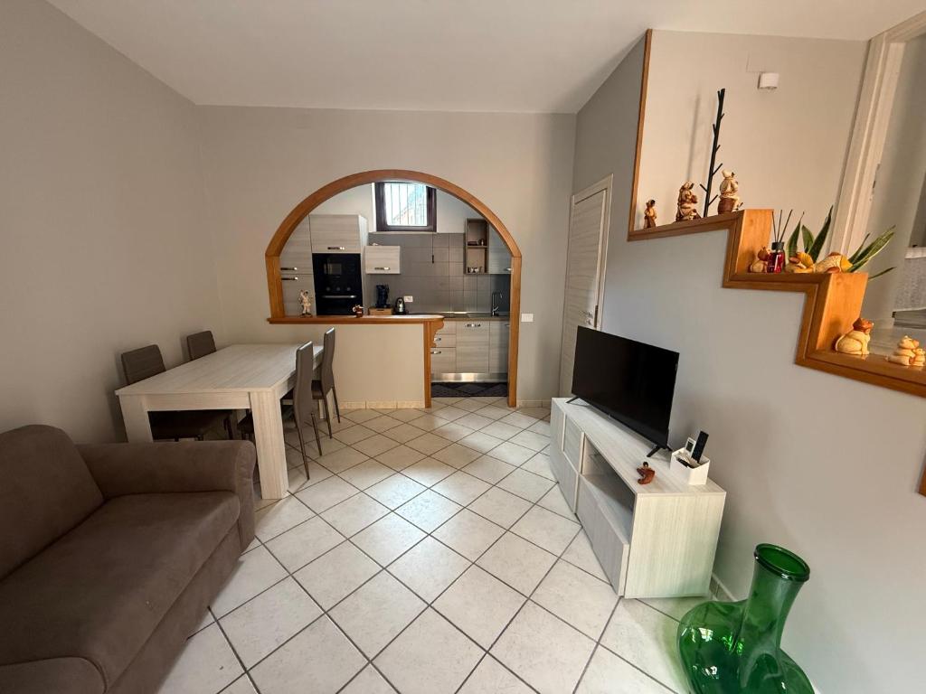 a living room with a couch and a table at Affittacamere Da Zia Maria in Montemiletto