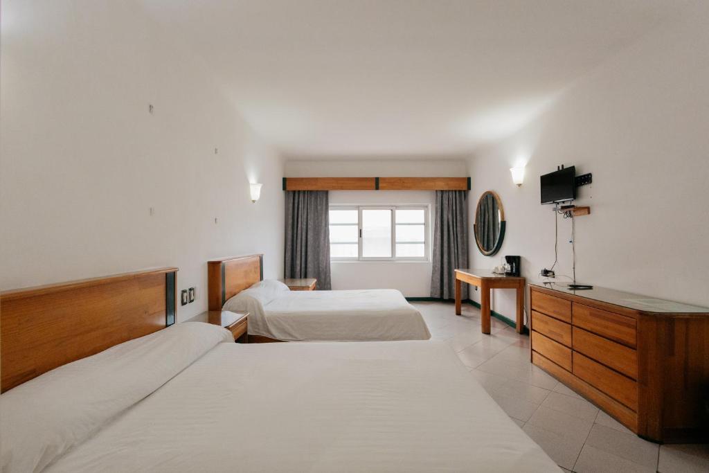 Postel nebo postele na pokoji v ubytování Casa Tobalá