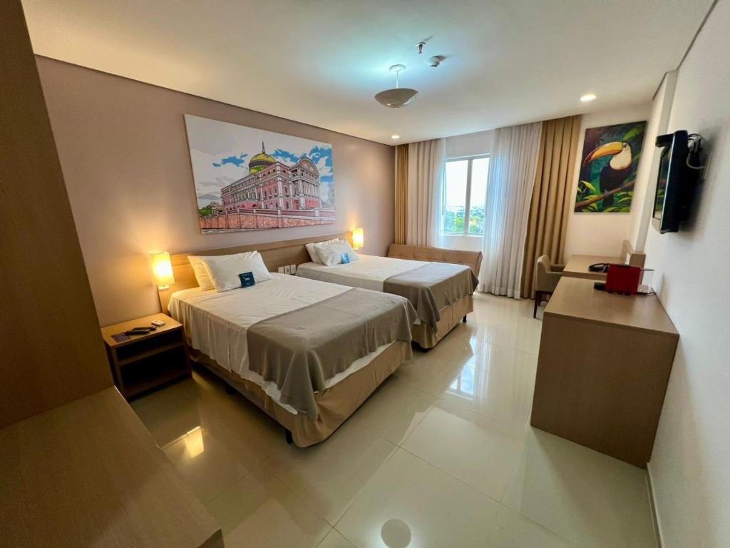 Ένα ή περισσότερα κρεβάτια σε δωμάτιο στο Linda Suite Blue Tree Premium Manaus