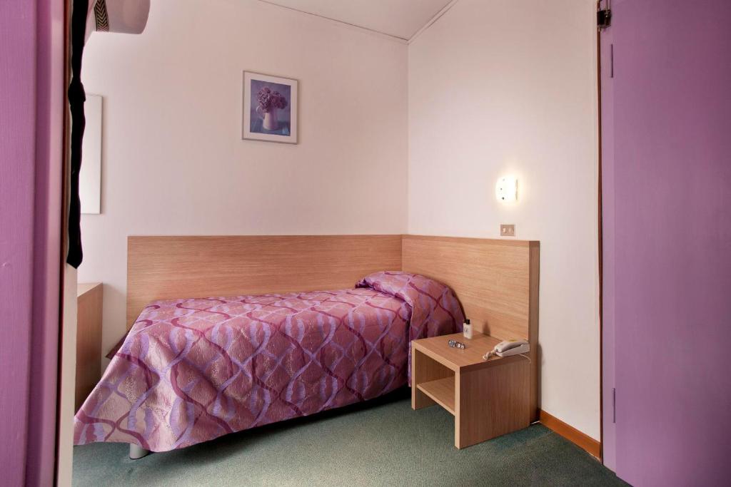 Postel nebo postele na pokoji v ubytování Hotel Nettuno