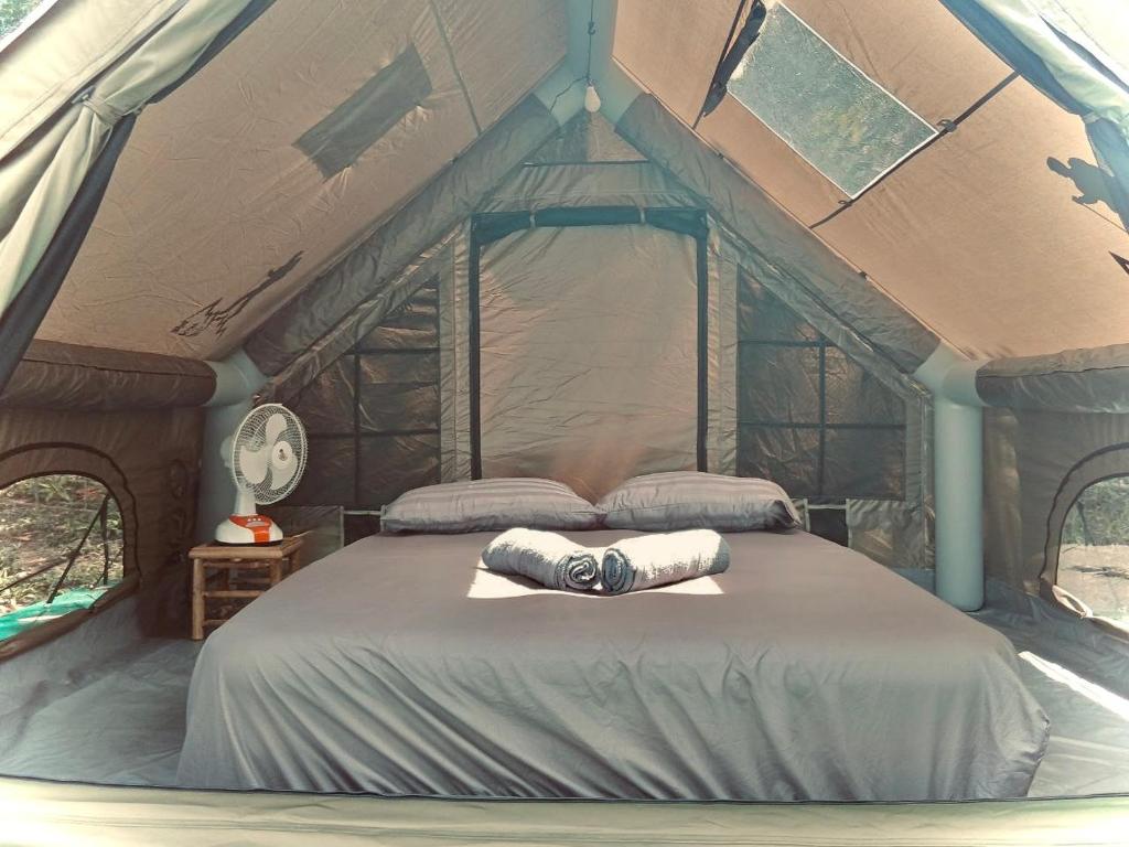 a bedroom with a bed in a tent at Bubble Paradise, Koh ta Kiev in Koh Ta kiev Island