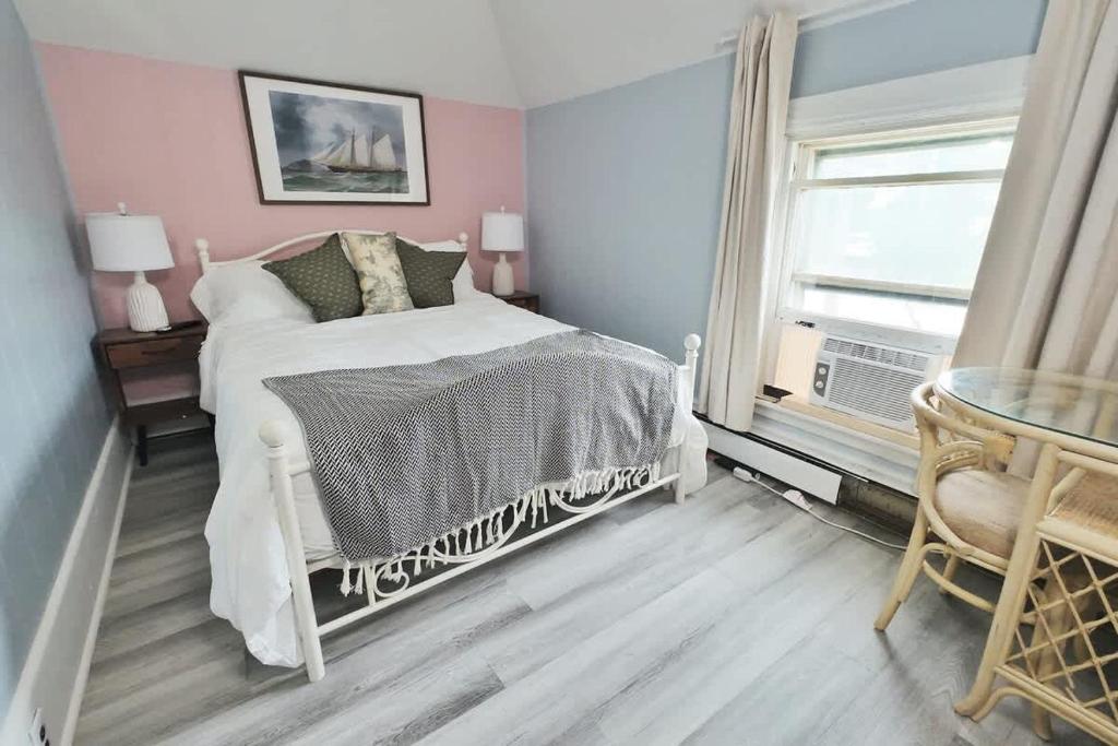 a bedroom with a white bed and a window at Chic & Sunny 1BR Hideaway- Apt 1 in Bridgewater