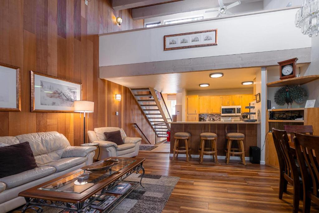a living room with a couch and a table at Creekside Chalet Stay for 6 in Kings Beach