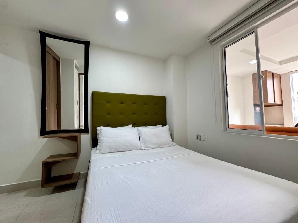 Ένα ή περισσότερα κρεβάτια σε δωμάτιο στο Velodromo